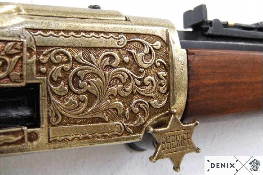Winchester, brass colored, engraved with wood shaft
