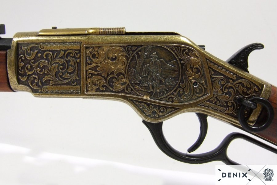Winchester, brass colored, engraved with wood shaft